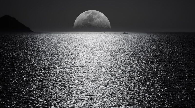 White and Black Moon With Black Skies and Body of Water Photography during Night Time