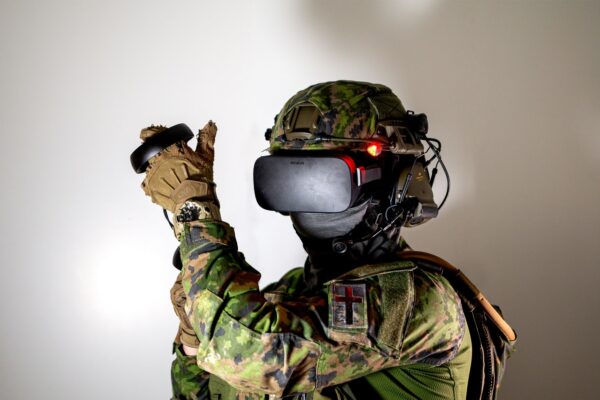 man in green and brown camouflage suit wearing black helmet