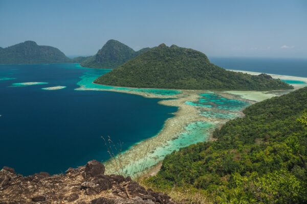green sea surrounded with mountains