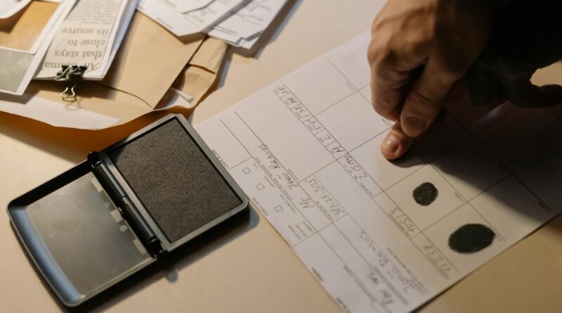 Close-up Photo of Putting of Fingerprint on Paper